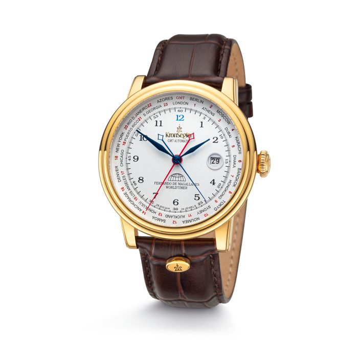 The gold and white model of the mechanical automatic watch "Magallanes" GMT with blue hands and brown leather strap in front view.